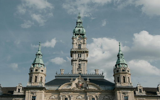 A large building with a clock tower and a blue sky from Chrome web store to be run with OffiDocs Chromium online A large building with a clock tower and a blue sky from Chrome web store to be run with OffiDocs Chromium online