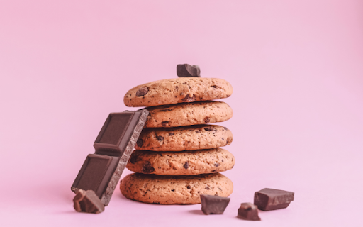 Four Chocolate Chip Cookies Stacked on a Pink Background from Chrome web store to be run with OffiDocs Chromium online Four Chocolate Chip Cookies Stacked on a Pink Background from Chrome web store to be run with OffiDocs Chromium online