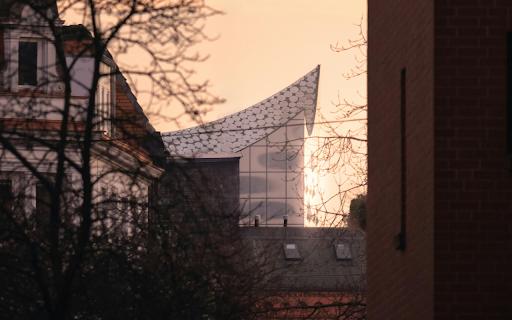 The sun is setting over a building with a large roof from Chrome web store to be run with OffiDocs Chromium online The sun is setting over a building with a large roof from Chrome web store to be run with OffiDocs Chromium online