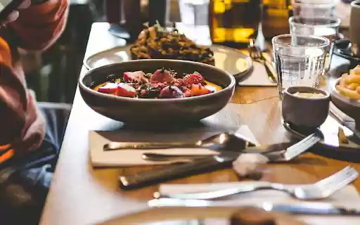 A Person Taking a Picture of Food on a Dining Table from Chrome web store to be run with OffiDocs Chromium online A Person Taking a Picture of Food on a Dining Table from Chrome web store to be run with OffiDocs Chromium online