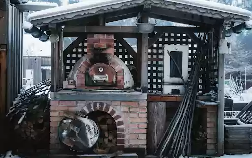 Cozy Outdoor Pizza Oven in Snowy Setting from Chrome web store to be run with OffiDocs Chromium online Cozy Outdoor Pizza Oven in Snowy Setting from Chrome web store to be run with OffiDocs Chromium online
